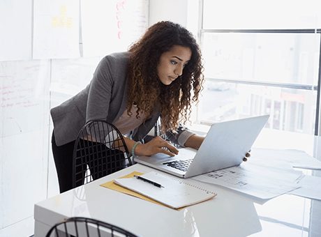 Stock image of a business woman working on her laptop